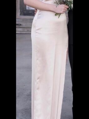 Revelry Satin Dress in champagne.